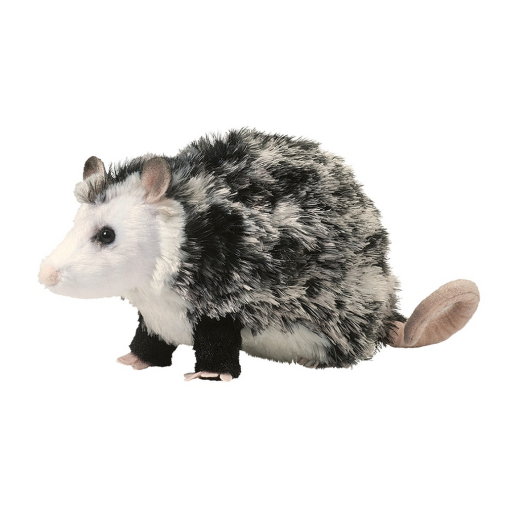 Oliver Possum is a realistic plush possum. It has a pink nose, ears, feet, and curled tail. The underbelly and face are white fabric with plastic bead eyes. The body is various grey colors with solid black legs. Oliver Possum is safe for ages 2 and up and machine washable.