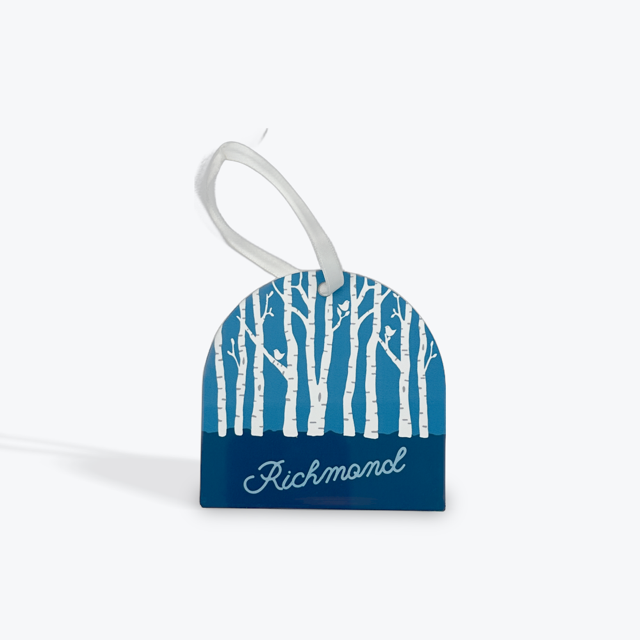 Metal ornament with blue background and white birch trees. Richmond is printed at the bottom. 