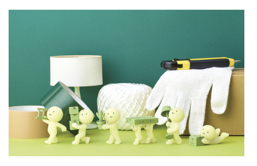 Greene glow in the dark Smiski collectible figures. The Moving series has six possible figures carrying items like boxes, a ladder, a plant, and a lamp. 