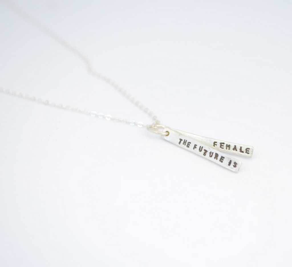 Reclaimed Silver bars stamped with "The Future is Female" on a silver chain necklace.