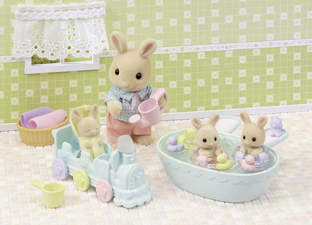 Calico Critters Milk Rabbit Triplets bathtime set, two of the triplets are in the bath tub and one is in the choo choo train wraped in a towel. There is a Calico Critters dad figure in this scene. 