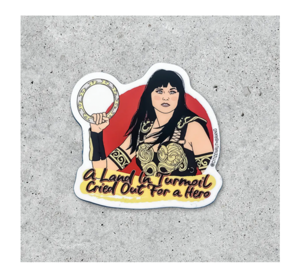 Sticker of tv show star Xena, Warrior Princess with text "A land in turmoil cried out for a hero."