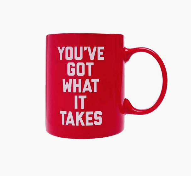 Red ceramic mug with white letters thet read "You've got what it takes"
