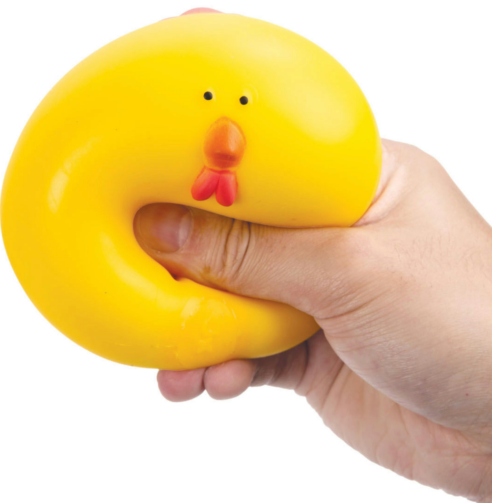 Close up picture of a hand squeezing the 100% Naturally Squishy Chicken. 