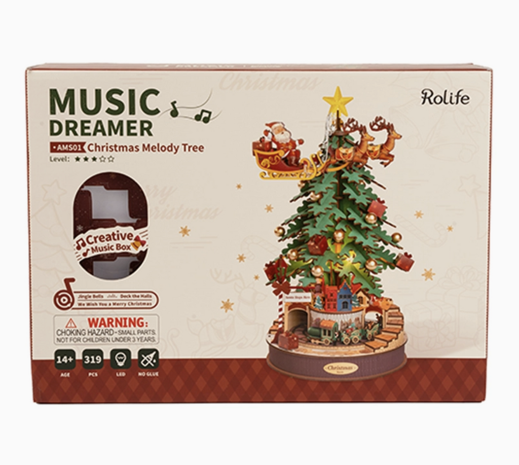 Box cover for the Christmas Melody Tree with a color picture of the completed 3D wooden Christmas Tree that is also a music box. 