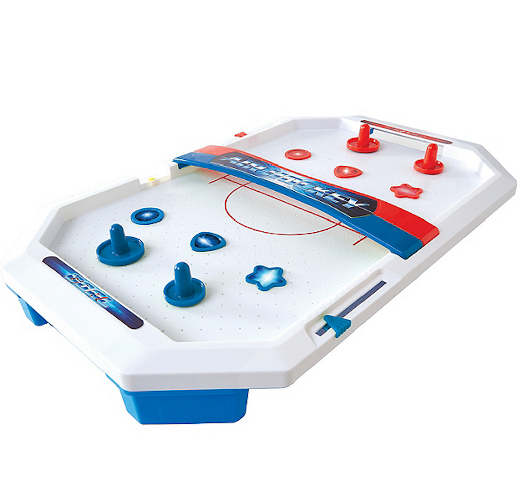 Close up of the Air Hockey Table with blue and red accessories. 