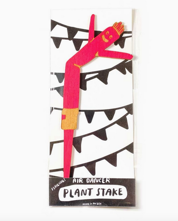 Hot pink plant stake shaped like an air dancer on a white and black backing card.