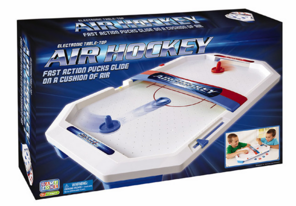 Electronic Table Top Air Hockey game box with an image of the air hockey table and pictures of kids playing the game. 