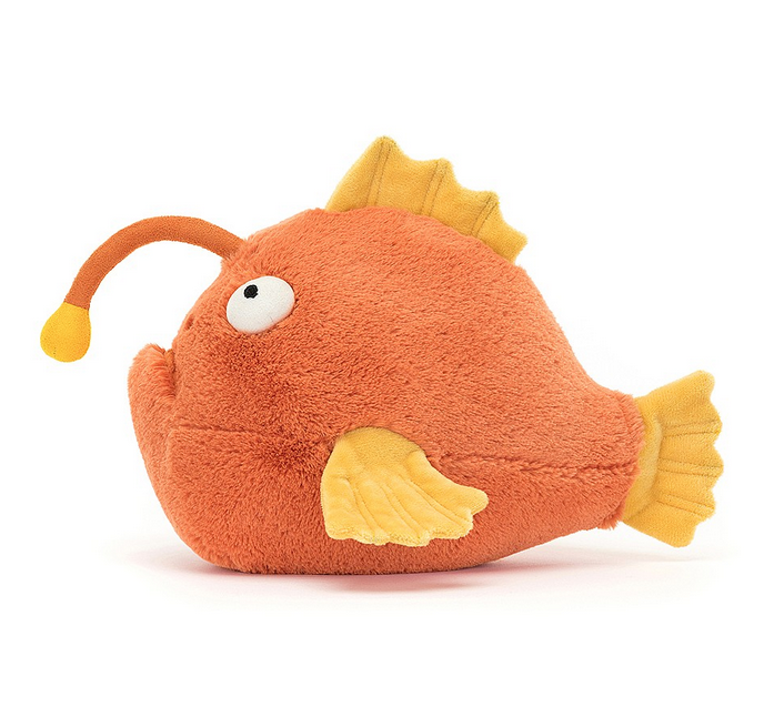 Side view of Alexis Anglerfish with terracotta fur and a suedette torch! With huge bobble eyes, stitched nose and mouth, and glorious golden segmented fins.