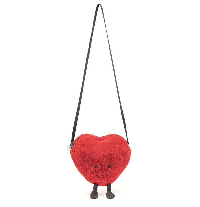 The Amuseable Heart Plush Bag supended from the length of the shoulder strap. 