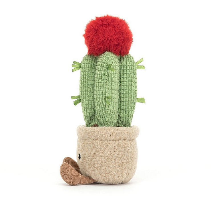 Side view of the plush Amuseable Moon Cactus with textured plush quills and red bloom. 