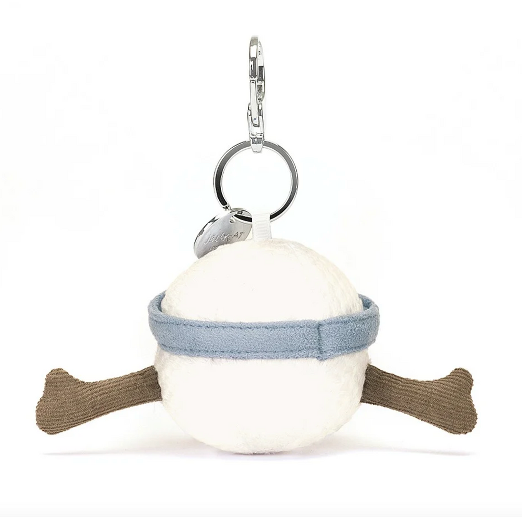 Back view of the plush Amuseable Sports Golf Ball Bag Charm, with blue visor and brown courduroy arms. Has a  silver clip