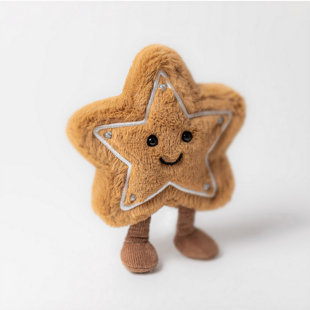 Star-shaped plush toy with a smiling face on a white background