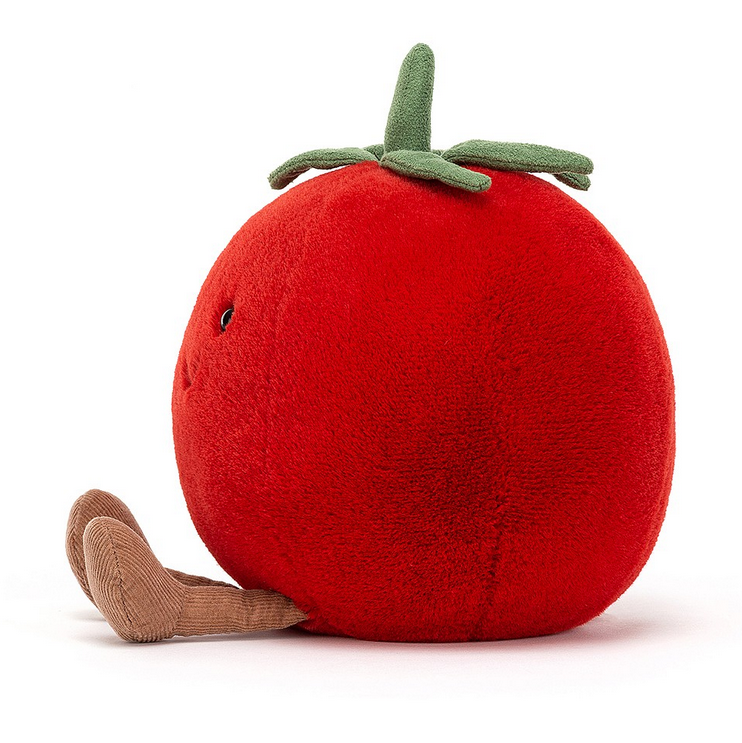 Side view of the plump ripe red Amuseable tomato plush. 