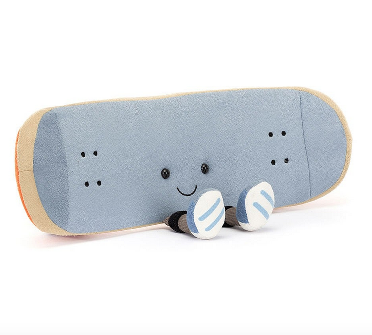 View of the front of the Amuseable Sports Skateboard, with gray plush grip and matching shoes.