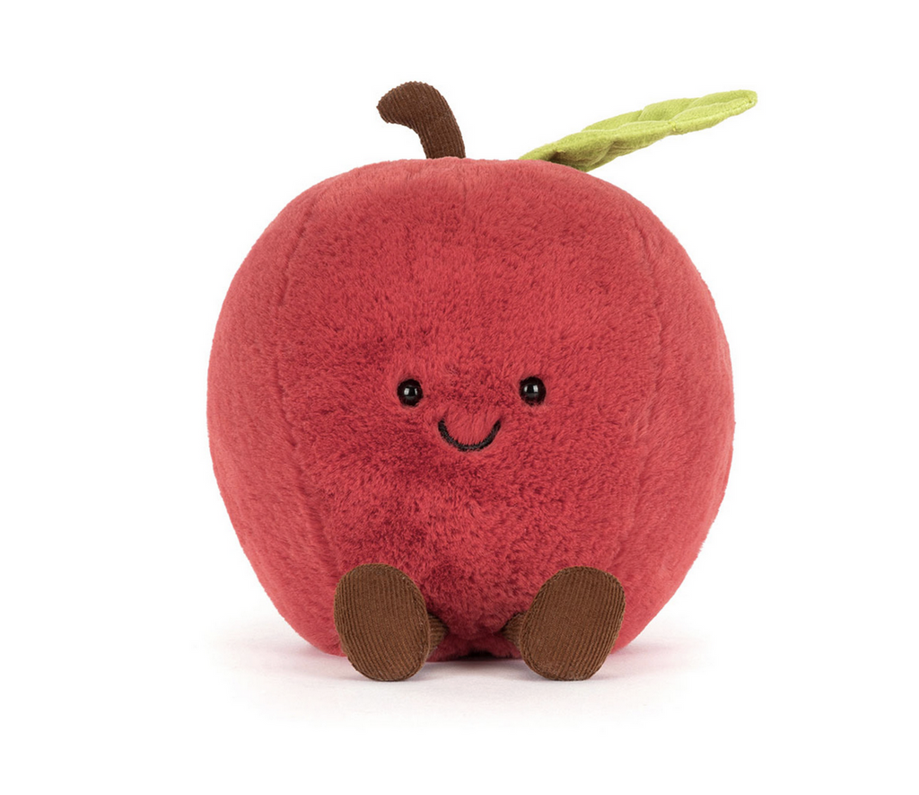 Red plush apple with a smiley face on a white background.