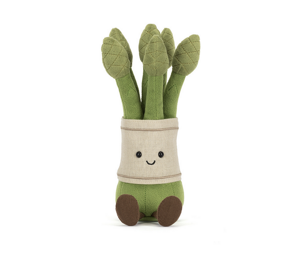 Bundle of asparagus from Jellycat. Spring's favorite vegetable is here in plush form with bright green stalks bunched together with a burlap band. 