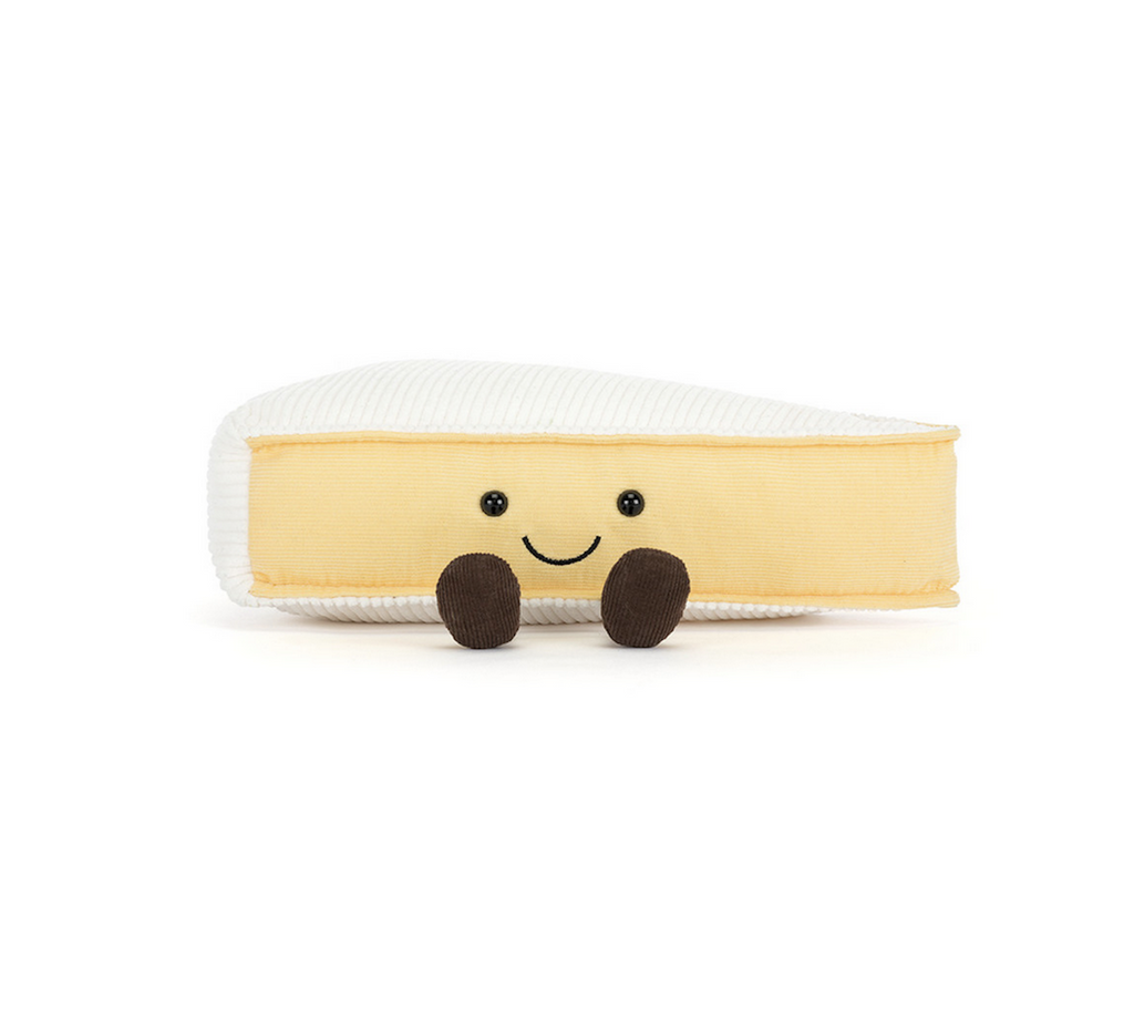Plush wedge of Brie cheese with a cute face and corduroy boots. 