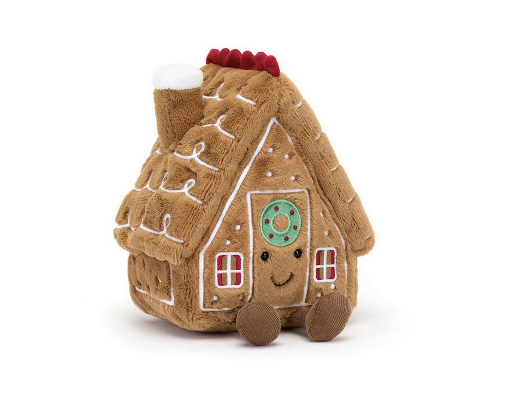 Plush Gingerbread House with a green wreath above the door from Jellycat. 