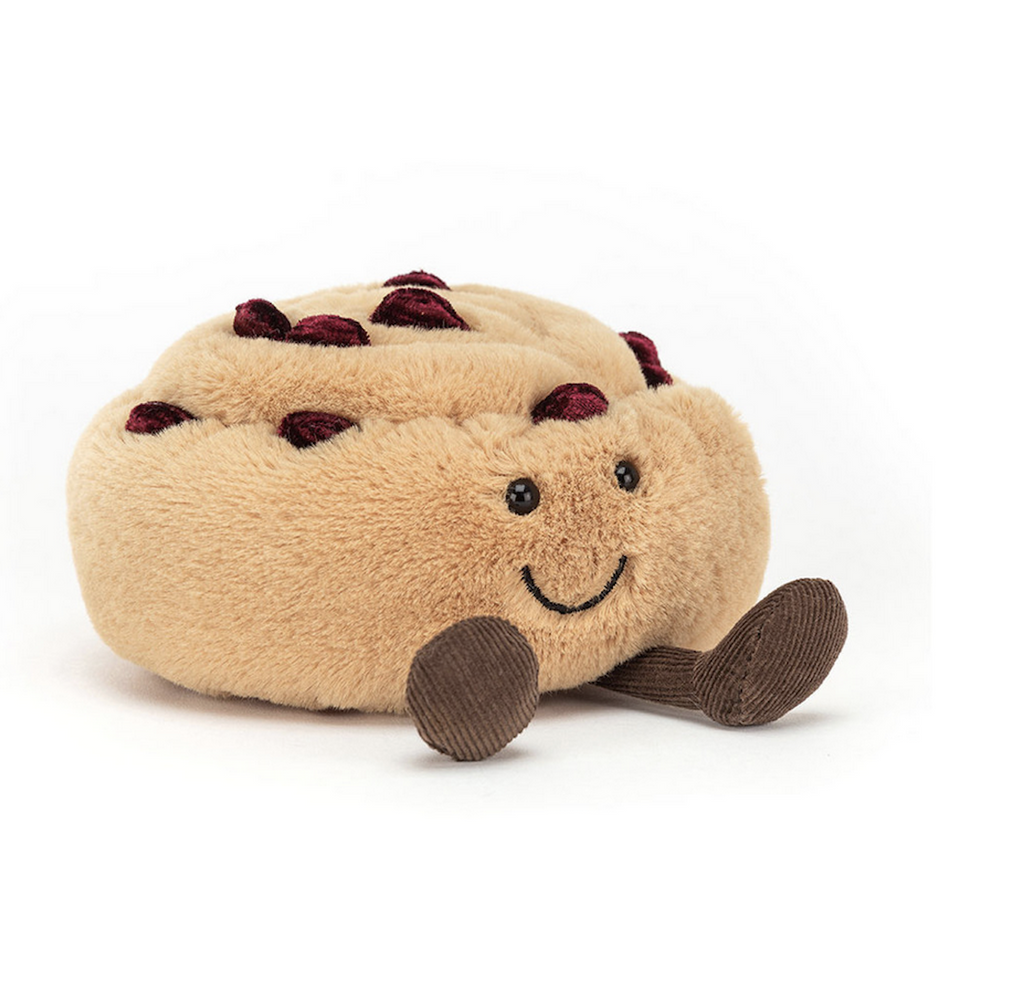 Plush Pain Au Raisin with a smiling face and corduroy boots. 