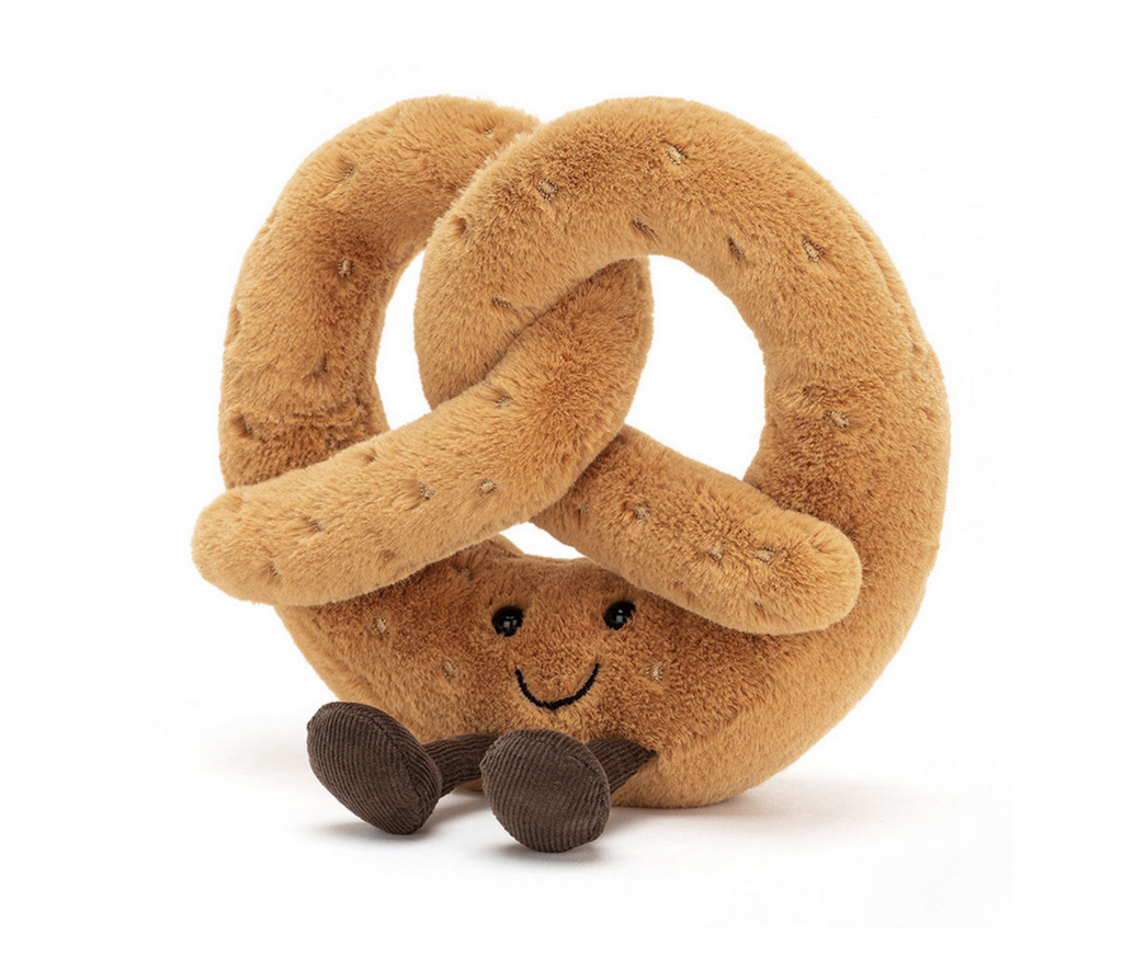 Plush, soft pretzel with smiling face and brown corduroy boots. 