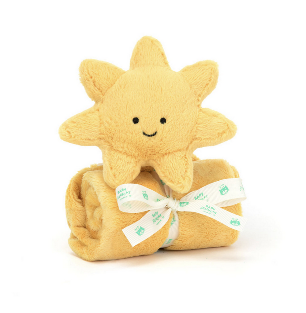 Plush yellow sun atop the attached blanket which is rooled up and tied with a ribbon. 