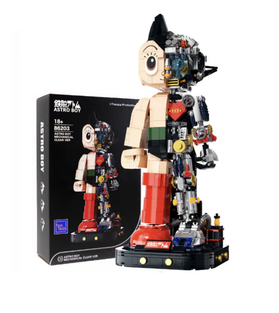 The Astro Boy Mechanical brick model fully built and set up in front of the box it comes packaged in. 