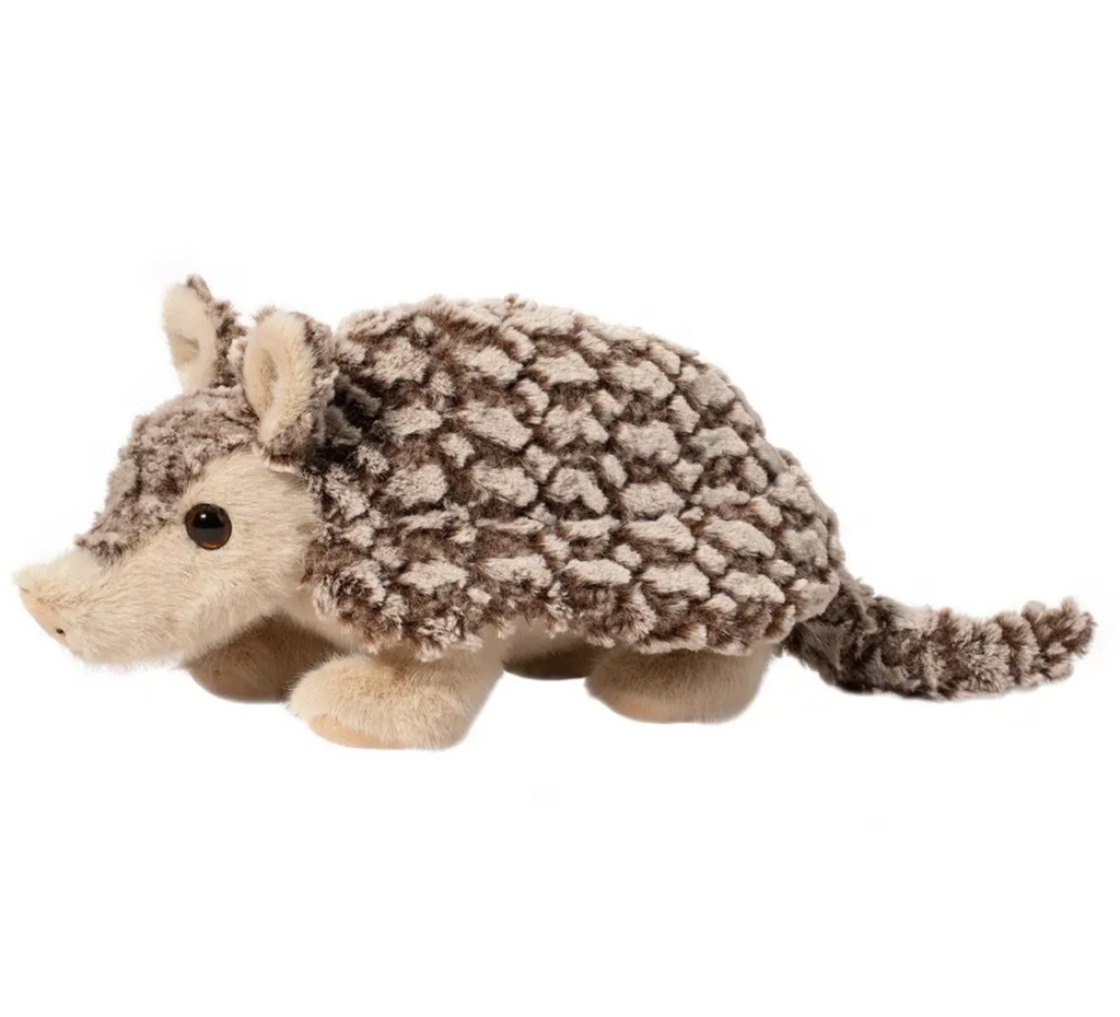 Plush armadillo viewed from the side with a soft shell and long tail. 