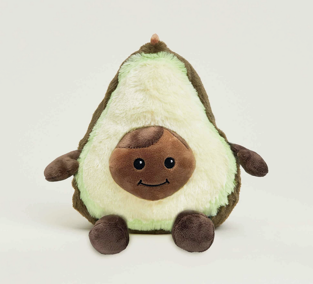 Weighted plush avocado with a sweet smiling face featured in the pit. 