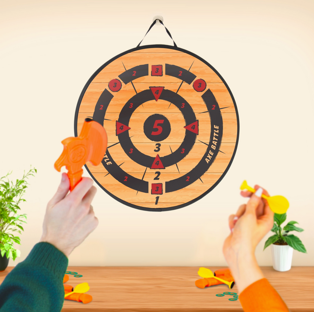 Wooden dartboard with darts on a wooden table against a light wall.