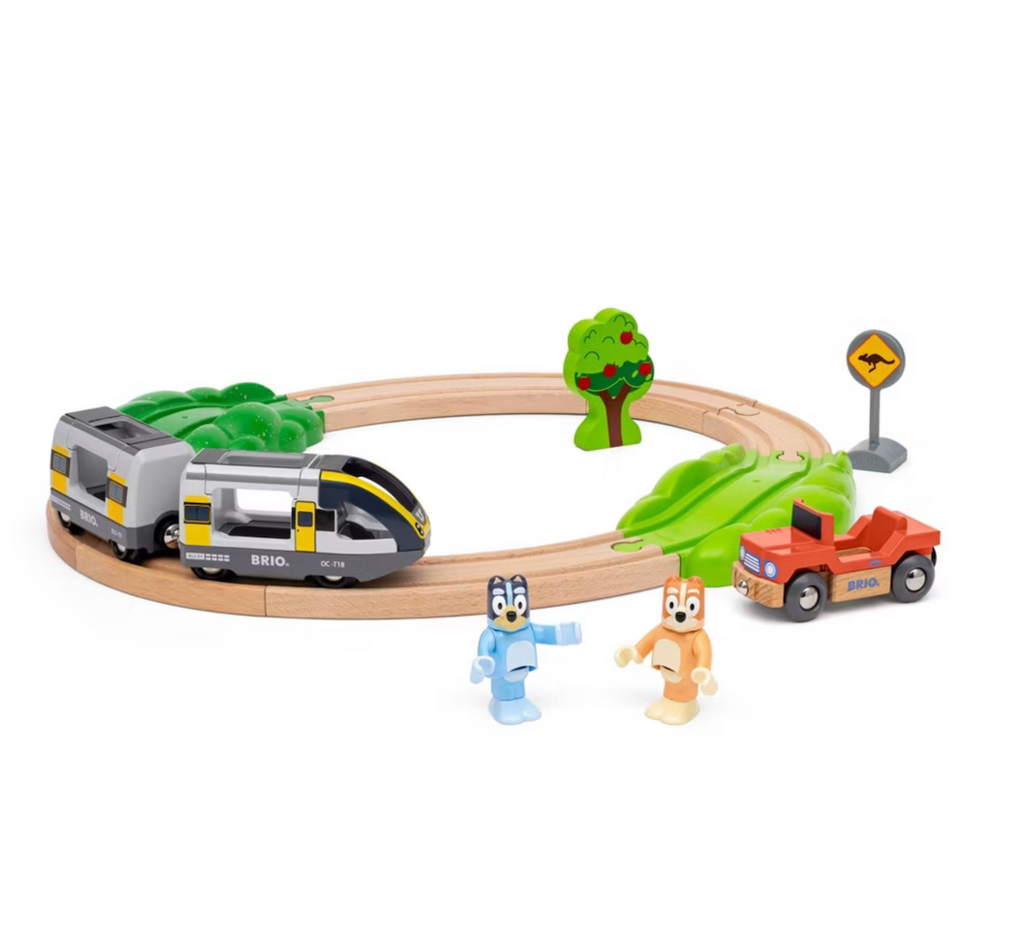 A basic wooden train set with  Bluey and Bingo figures, two train cars and the Heeler family vehicle. 