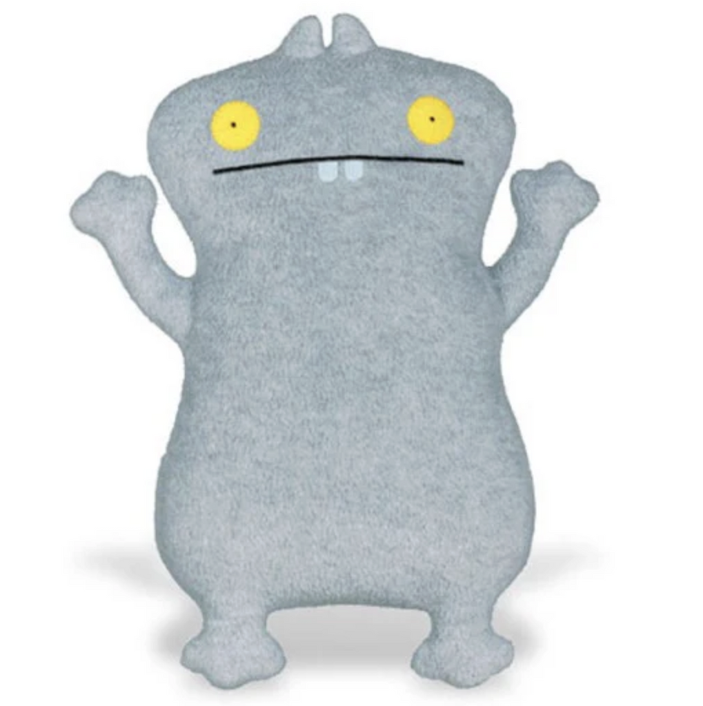 Grey plush Babo Uglydoll with yellow eyes and two front teeth. 