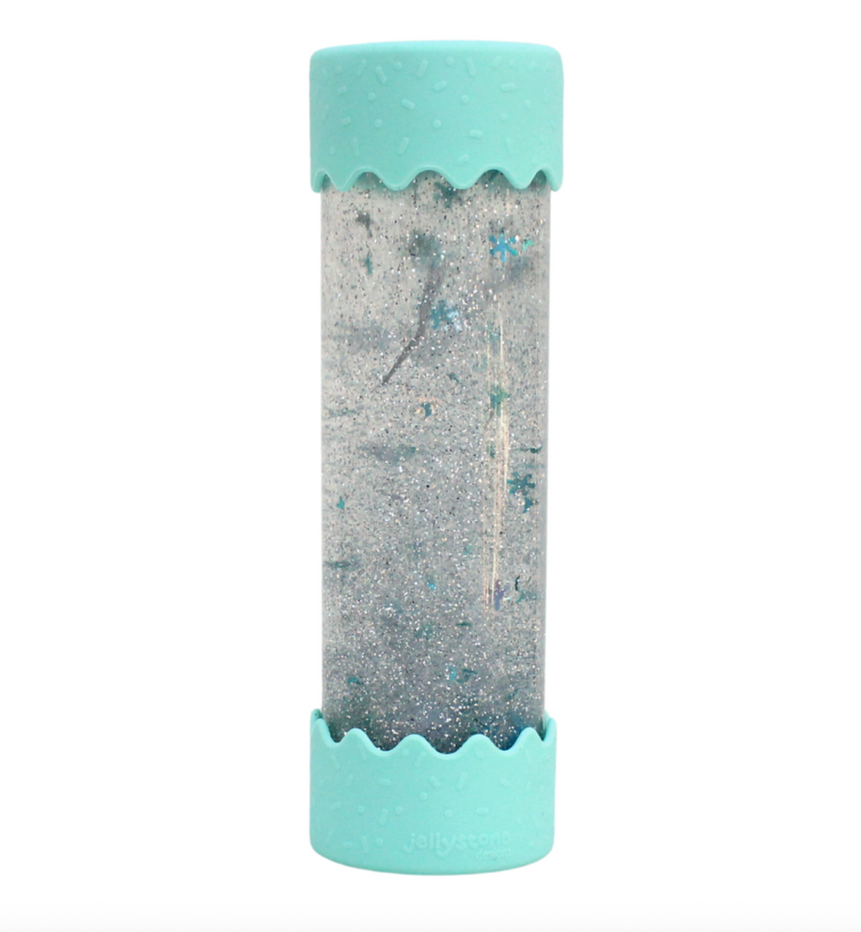 The Baby Calm Down Bottle with mint colored silicone on each end of the tube which holds silver glitter, and mint colored stars inside that swirls and moves inside the liquid within. 