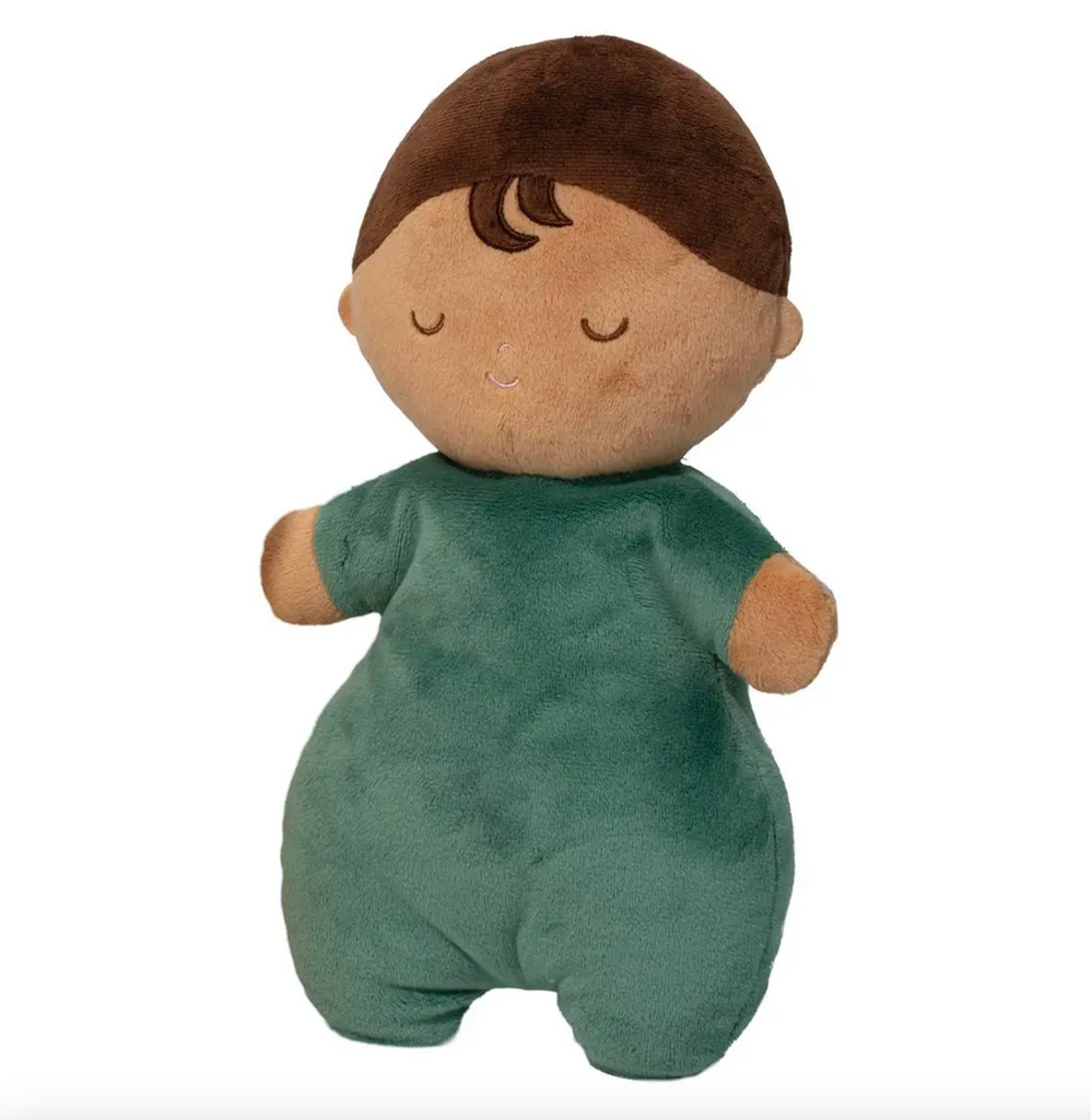 Plush baby doll with green bodysuit and sleepy face. 