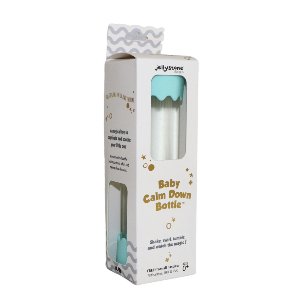 Baby Calm Down Bottle in Mint packaged in a box that has panels on each side open so that the soothing, swirling, magic liquid in the bottle can be seen. 