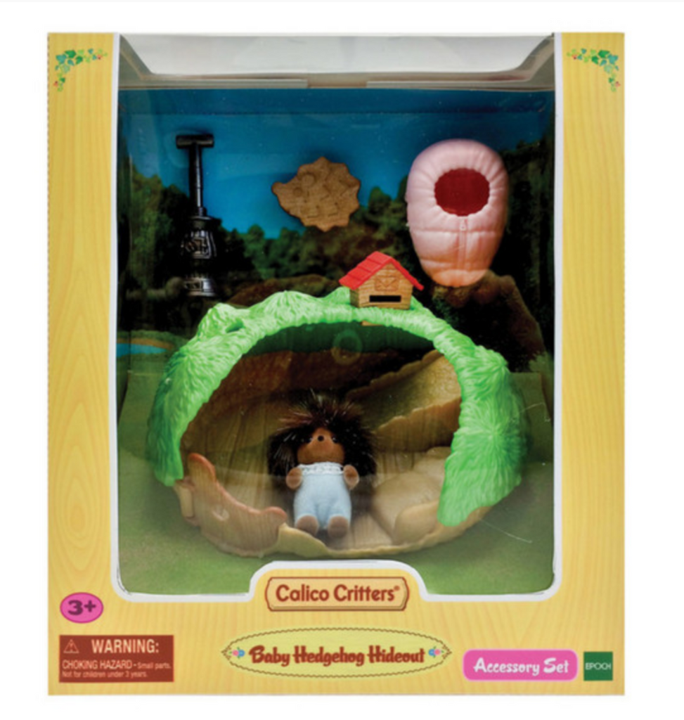 Calico Critters Hedgehog Hideout with Baby Bilberry figure packaged in a box with clear window. 