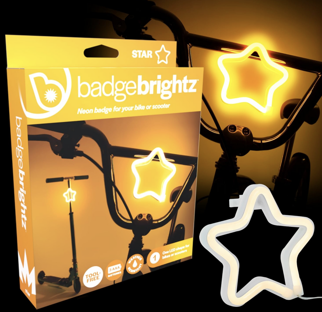 Badge Brightz star shaped bicycle and scooter light packaged in a bright yellow box with pictures of the star light attached tot he handlebars of a bike and a scooter. 