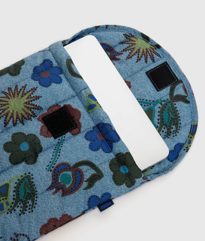Puffy Laptop sleeve with a laptop coming out of the top. 