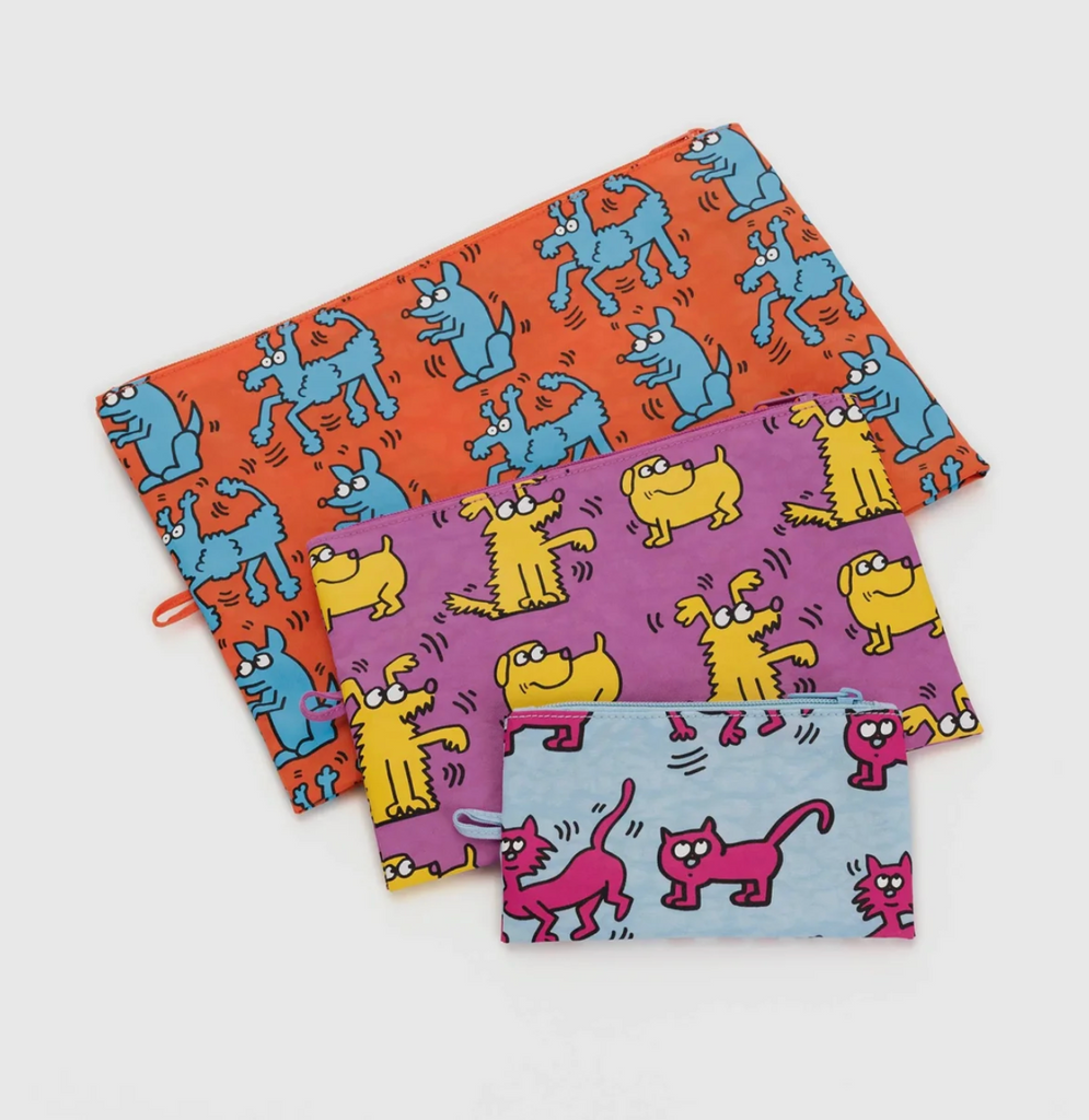 Three different sized "go" pouches in the Keith Haring "Pets" print. 