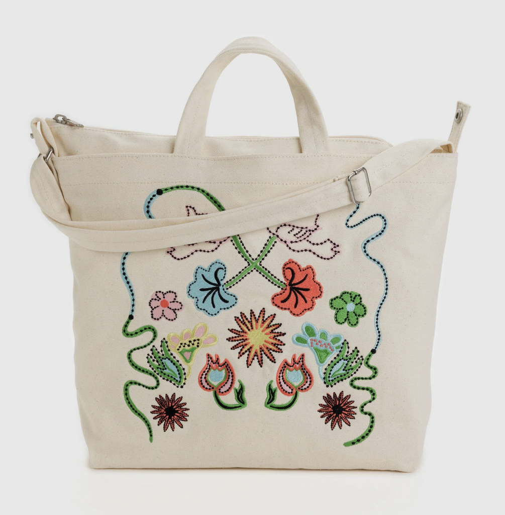 Close up of Horizontal Zip Duck Bag with Embroidered Birds print. 