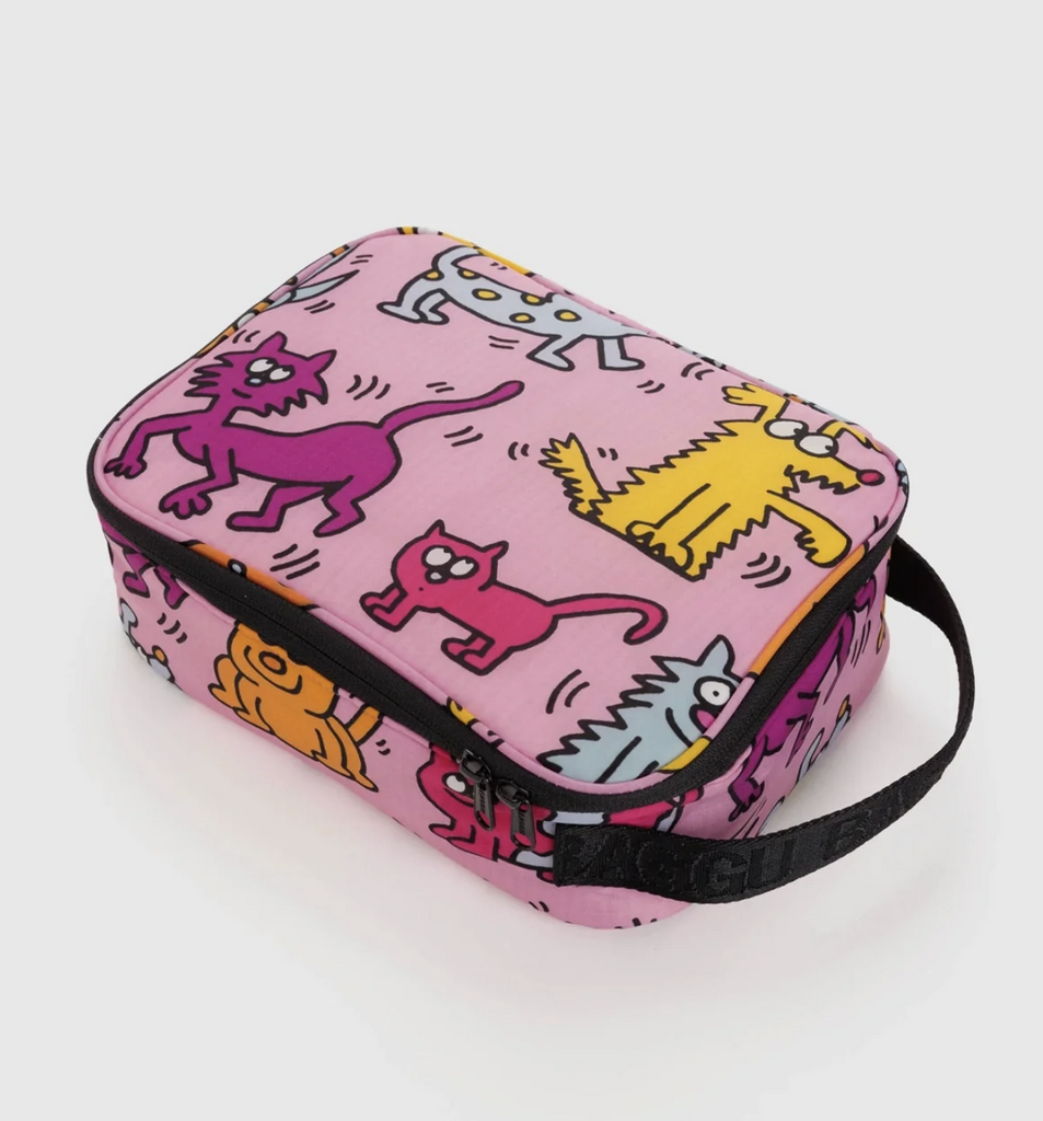 Insulated lunch box with black handle and Keith Haring "Pets" print. 