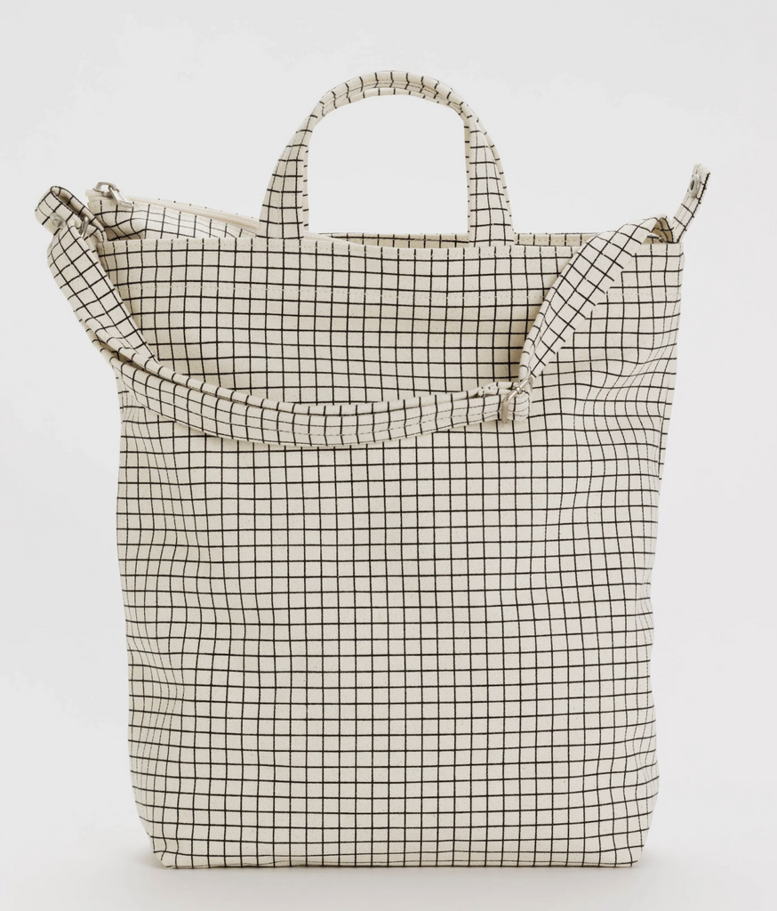 Close up view of the Baggu Zip Duck Bag in the Natural Grid print. 
