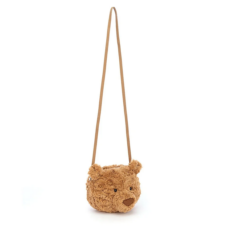 The Bartholomew Bear plush bag with the shoulder strap fully extended. 