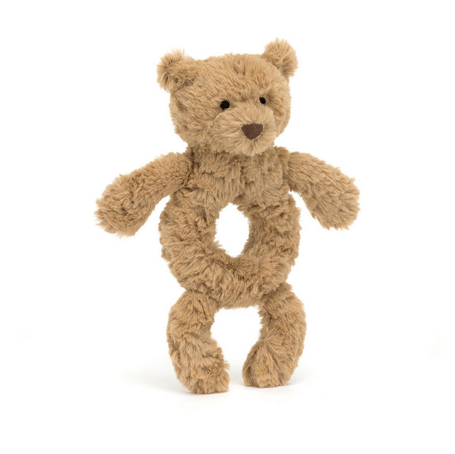 Bartholomew Bear with a ring rattle at his middle. 