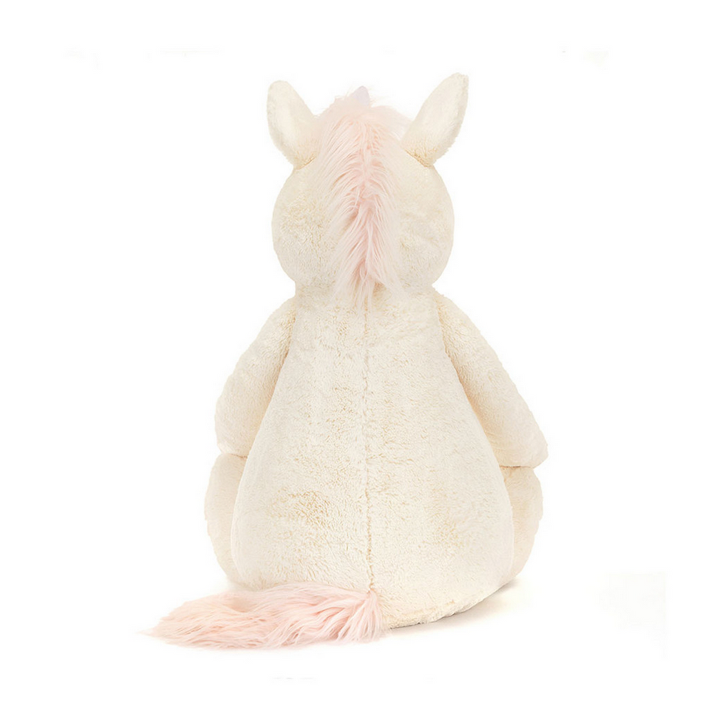 Bashful Unicorn Giant plush viewed from the back with it's pink mane and tail in full view. 