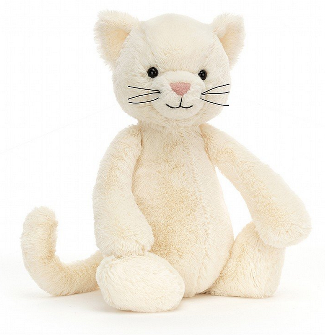 Cream colored plush kitty cat. 