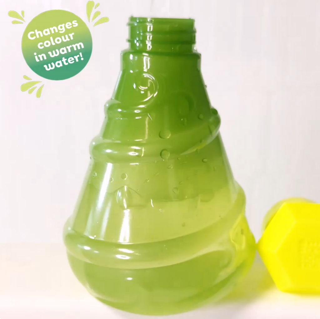 The Bath Magic Color Change Potion Bottle partially filled with warm water changing from green to yellow. 
