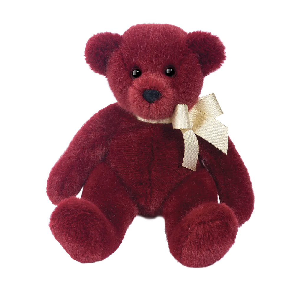 Berry a scarlet red plush teddy bear with a shiny old ribbon tied around it's neck. 