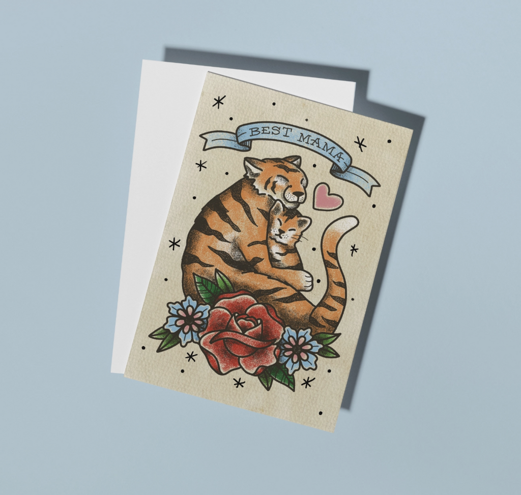 Greeting card illustrated with a mama tiger holding a baby tiger with a banner that reads "Best Mama" and flowers along the bottom. 