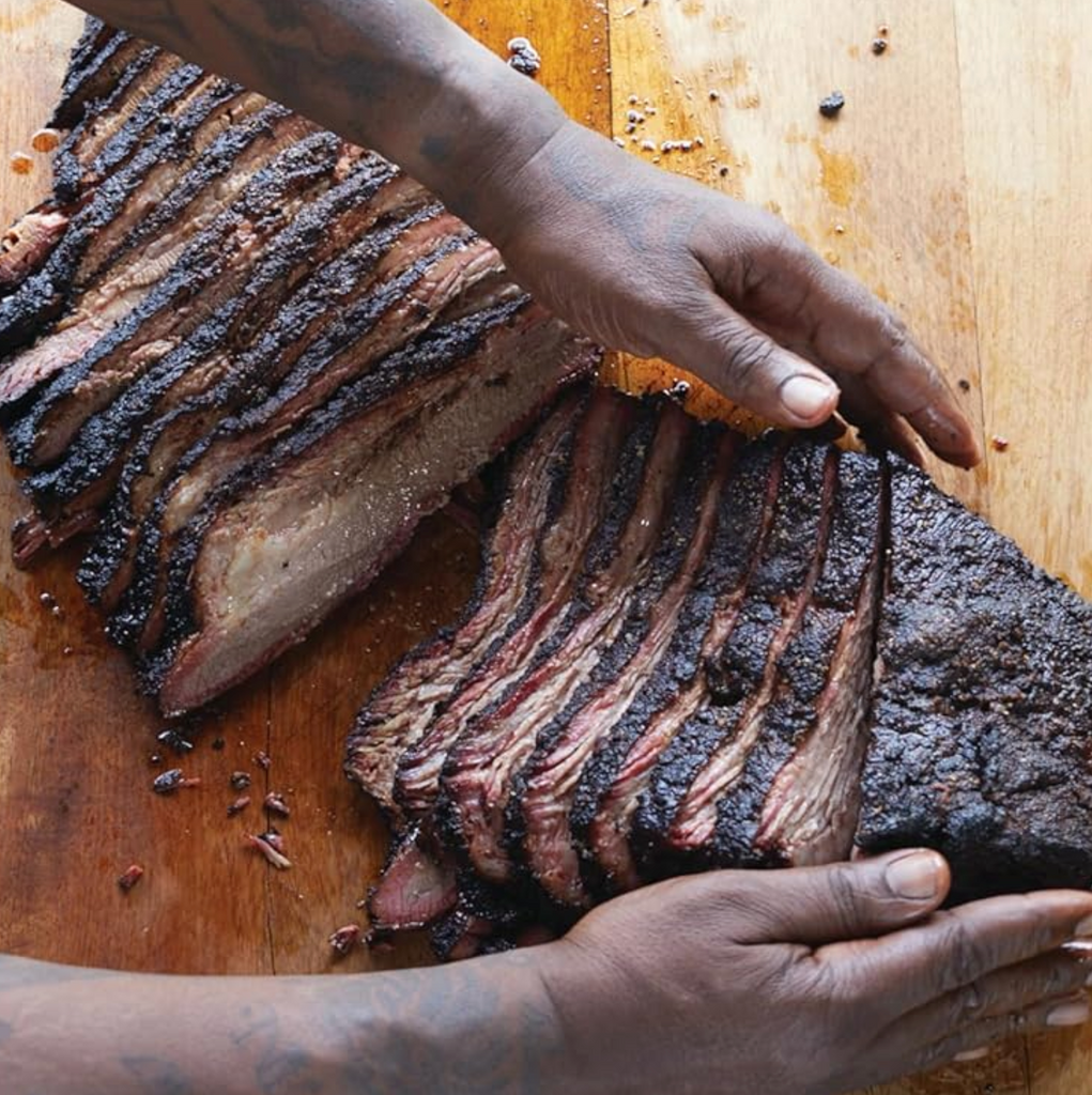 A picture of sliced brisket from a recipe featured in the book.